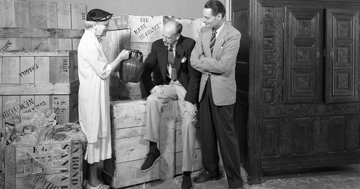 Florence Dibell Bartlett, Robert Bruce Inverarity, and Paul Coze examine a gift from France (image by Ernest Johanson, July 27, 1953)